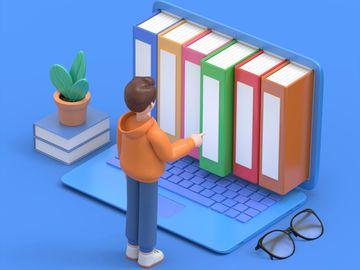 A person organizing colorful binders on a laptop keyboard.