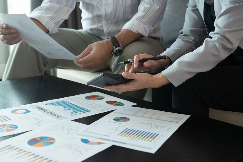 accountant or business people are calculate valuation and appraisal value of property business company and stock.