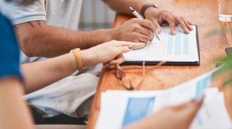 People analyzing data charts together.