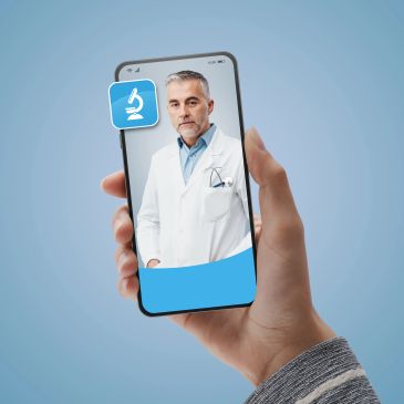 Telemedicine app showing a male doctor on a smartphone.
