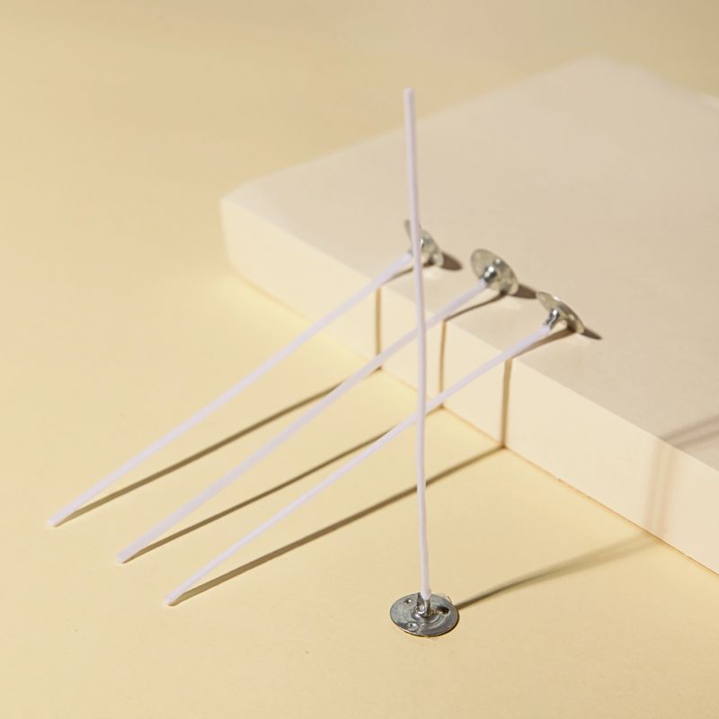 Candle Wicks on Beige background. Making homemade candle