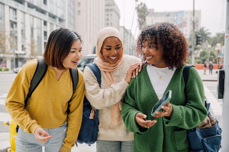 Teenager students meeting up in downtown to study together at the public library.