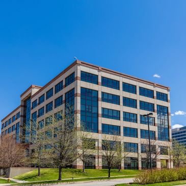 Commercial office building symbolizing on-site mobile notary and fingerprinting services in Central 