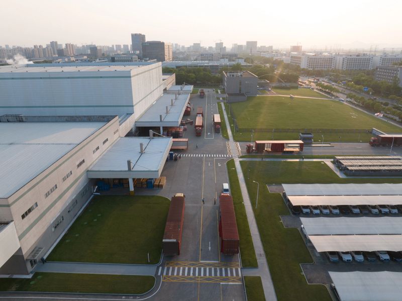 The large truck at the entrance of the logistics warehouse