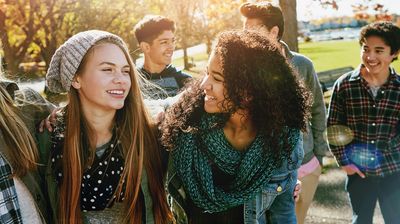 Diverse group of smiling teens spending time together. Symbolizes belonging and inclusivity