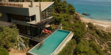 Modern house with infinity pool overlooking the ocean.