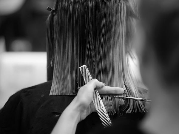 Woman getting haircut