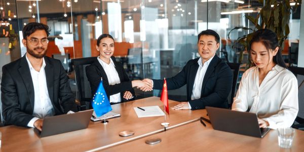 Business meeting with handshake between two professionals.