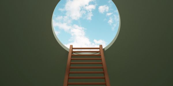 Ladder leading up to a circular opening showing blue sky and clouds.