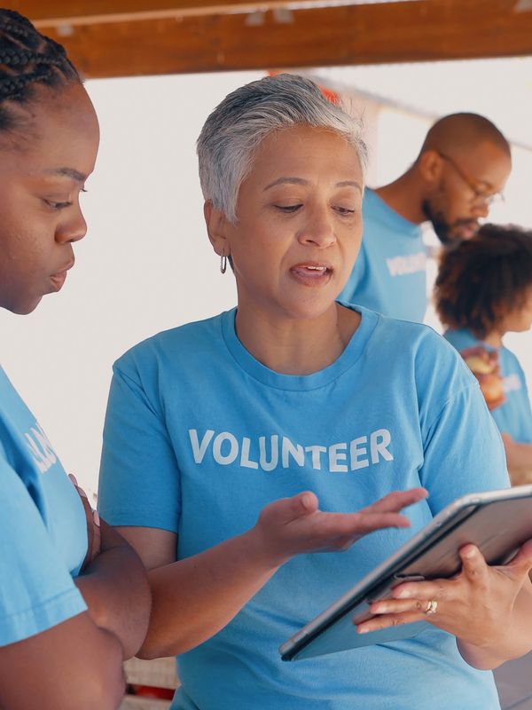 UMAI Foundation volunteers guiding kids in sewing — fostering healing, creativity, and growth.