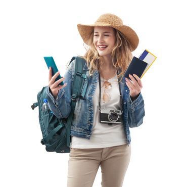 A smiling traveler wearing a hat and backpack while holding a phone and travel documents, ready for 