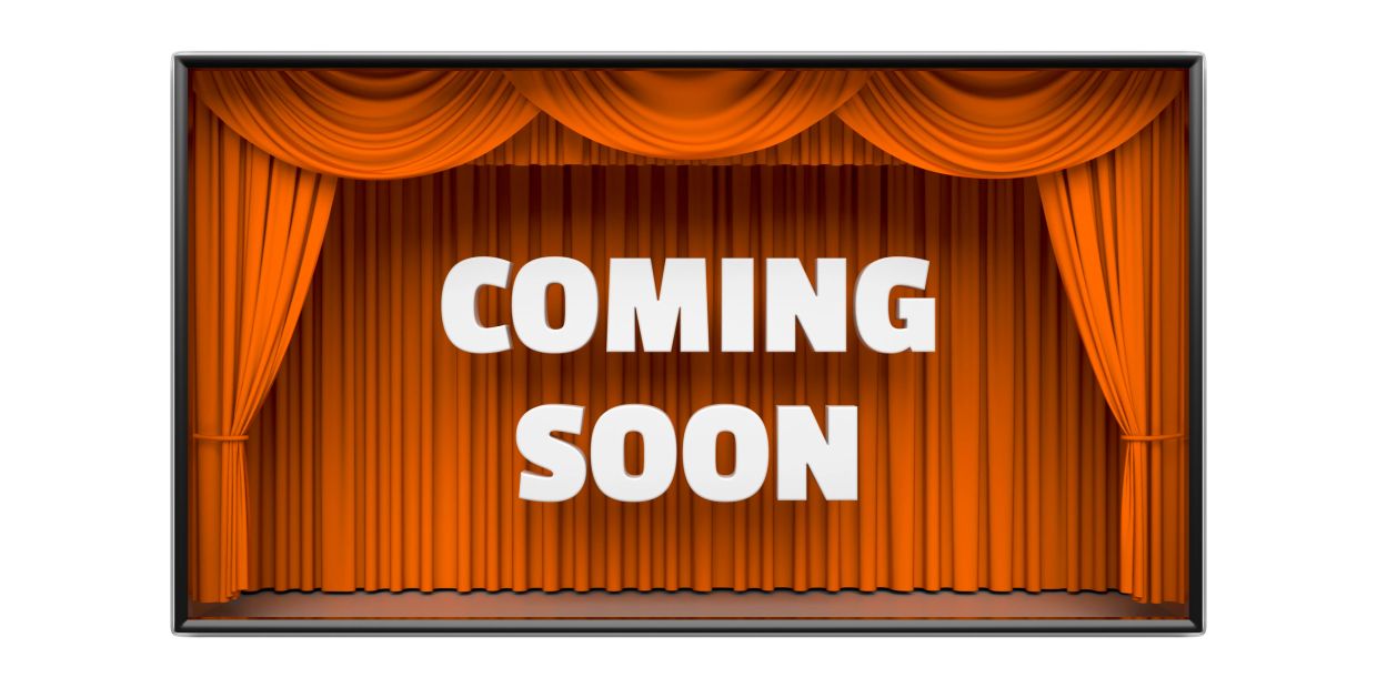 Theater stage with orange curtains and "Coming Soon" text.