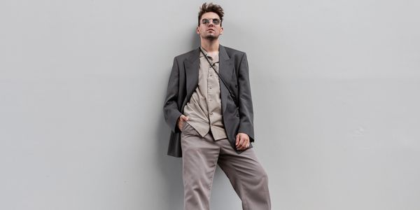 Stylish men showcasing TAG OUTFITS premium denim, hoodies, and streetwear fashion.