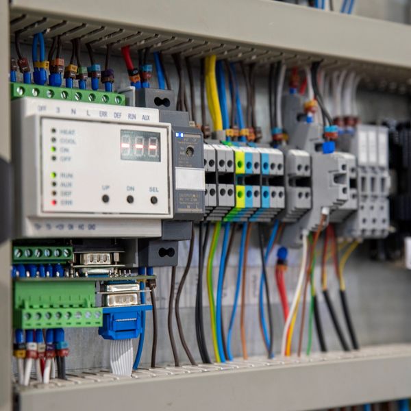 Close-up of an electrical control panel with wiring and components.