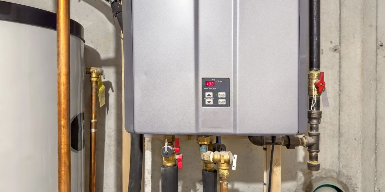 Tankless water heater with pipes and valves.