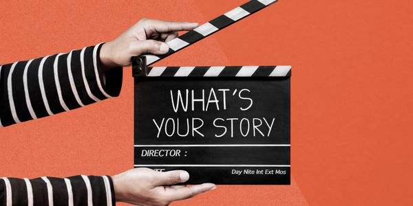 Hands holding a clapperboard saying "What's your story" on an orange background.