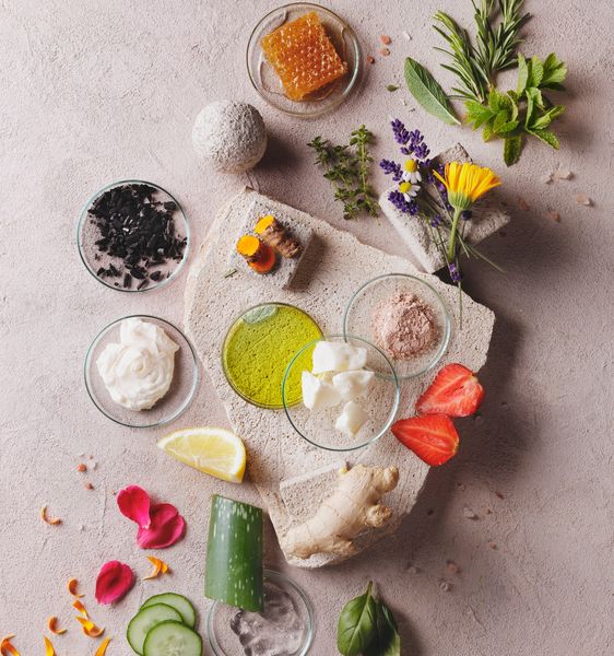 Natural skincare ingredients arranged artistically on a textured surface.