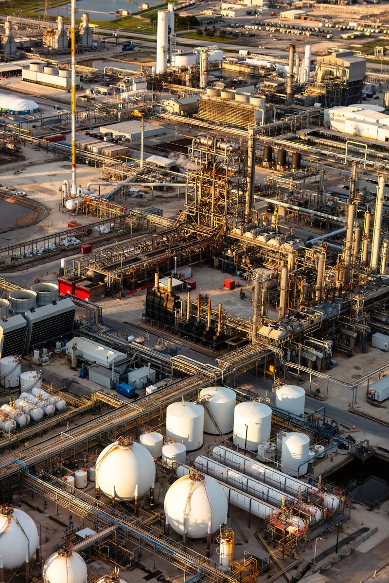 An aerial shot of an oil refinery on a sunny afternoon in Houston, Texas.