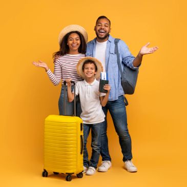 Happy family with suitcase and travel essentials ready to travel.