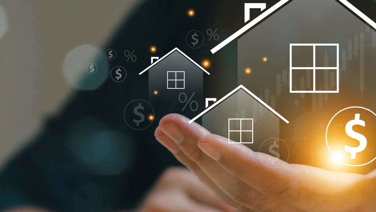 A person holding their hand out with a house in the middle