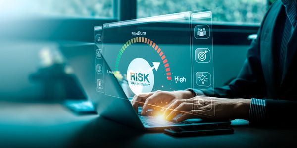 Risk management concept with digital interface on laptop.