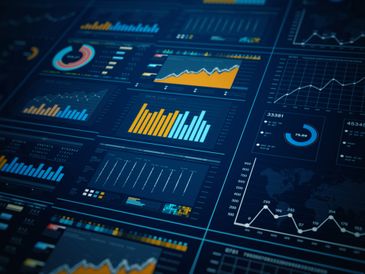 Digital dashboard displaying various colorful data charts and graphs.