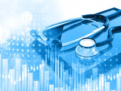 Stethoscope on tablet with digital medical data overlay.