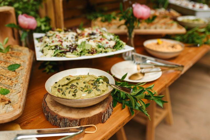 Fresh Guacamole in a Bowl. Food catering for a special occasion. Vegan food.