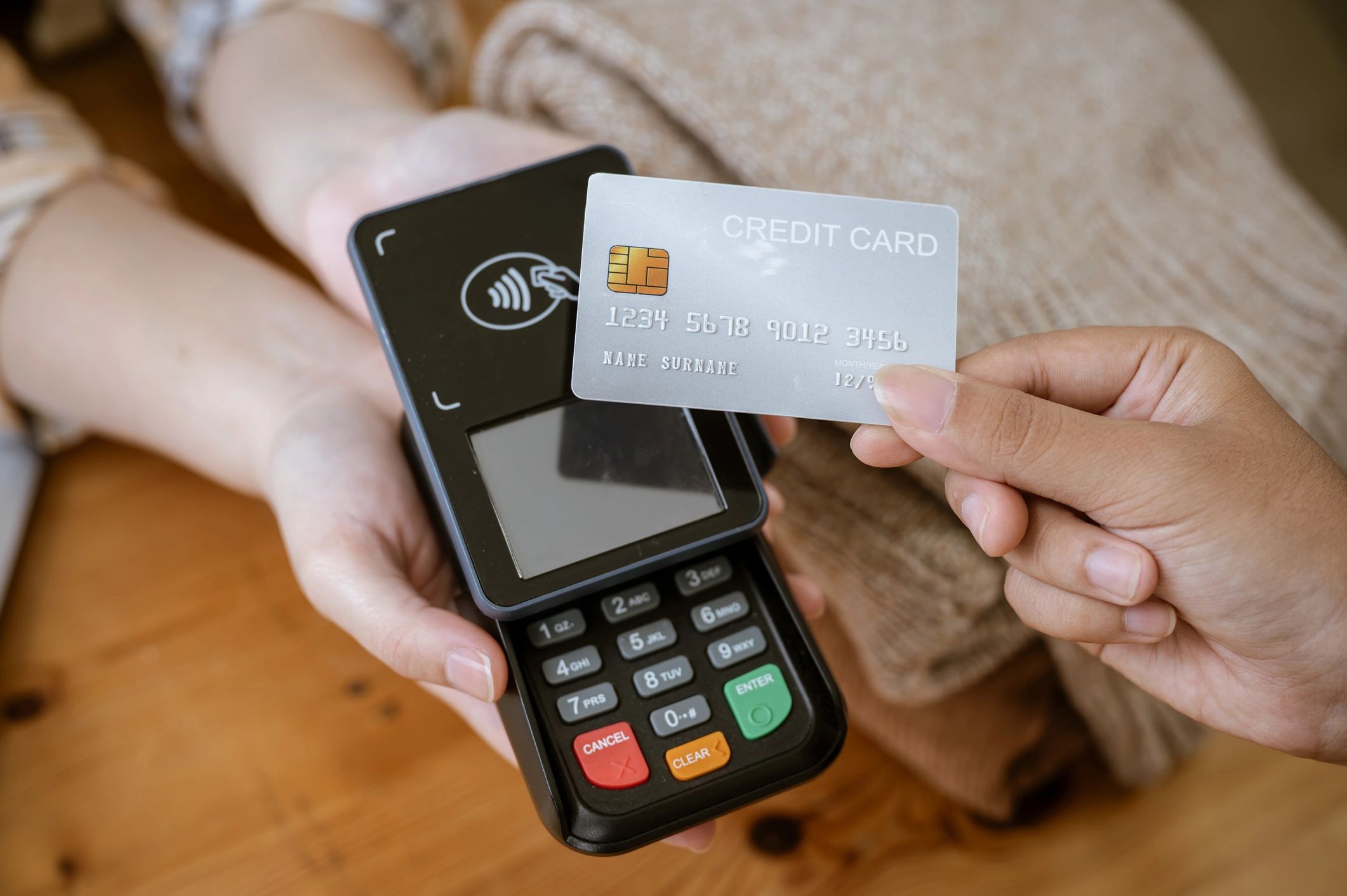 Contactless credit card payment with a card reader.