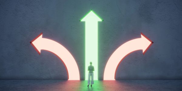 Person choosing between three arrow directions, with the middle one glowing green.