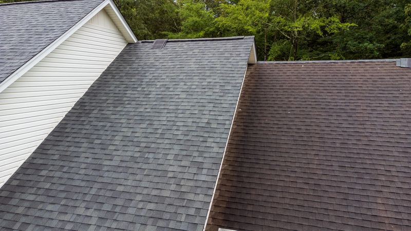 New roof and old roof on house, showing comparison of the two.
