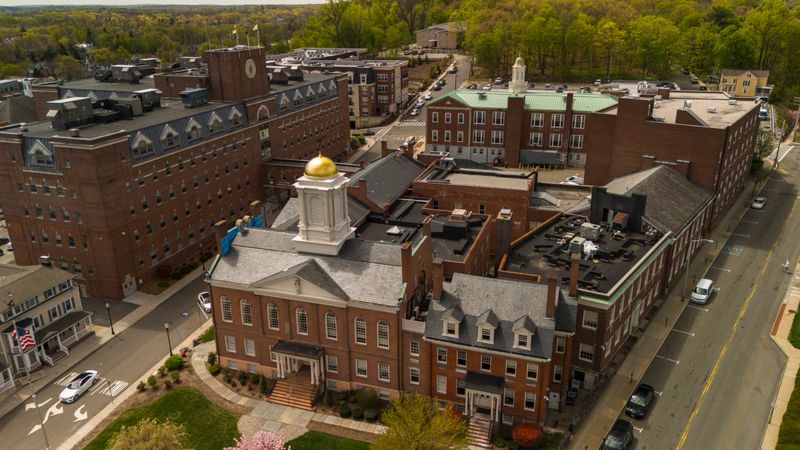 Public district in springtime Morristown, New Jersey. Morris County Courthouse and Government building stretching the street