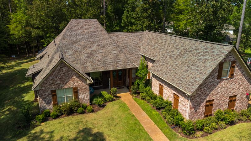 Suburban house with newly installed shingles