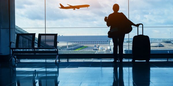 A traveler in an Airport waiting for their flight