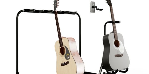 Two acoustic guitars displayed on different stands against a white background.