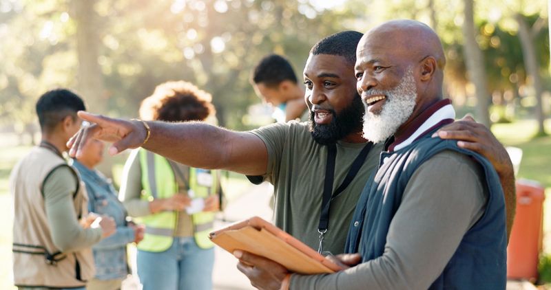 Park, people and volunteers planning with tablet for support, community project or nature sustainability. Humanitarian, recycling or senior leader in charity service or NGO for pollution cleanup