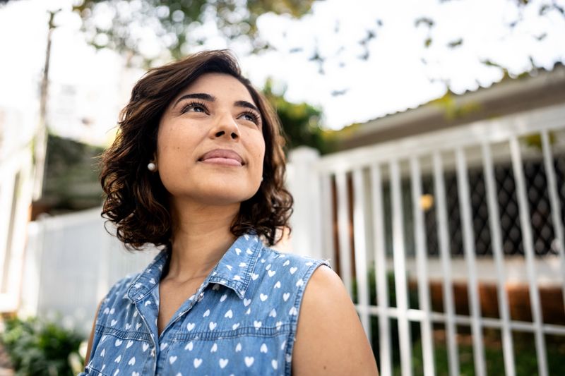 Mid adult woman contemplating outdoors