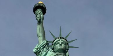 Close-up of the Statue of Liberty against a clear sky.