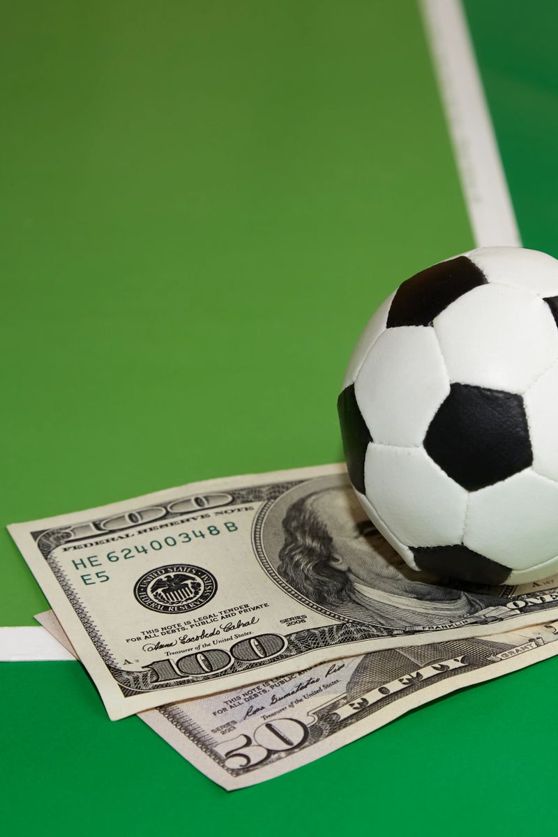 Soccer ball and dollars on green background, favorite soccer predictions, bookmaker betting, bet on sports, soccer poster, soccer backgrounds