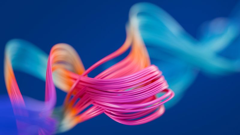 Abstract background of colorful thin wavy wires