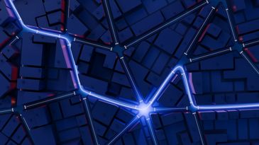 Glowing blue lines on a dark city map.