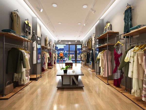 Modern clothing store interior with dresses and suits.
