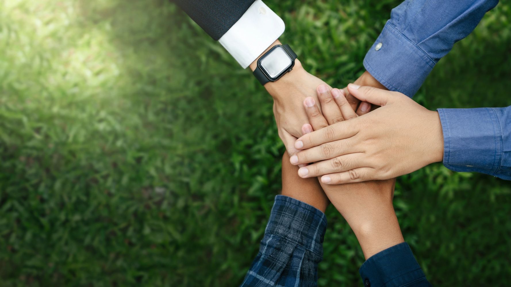 Hands joined in a circle of unity