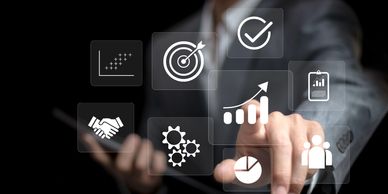 Businessman interacting with digital icons representing growth and success.