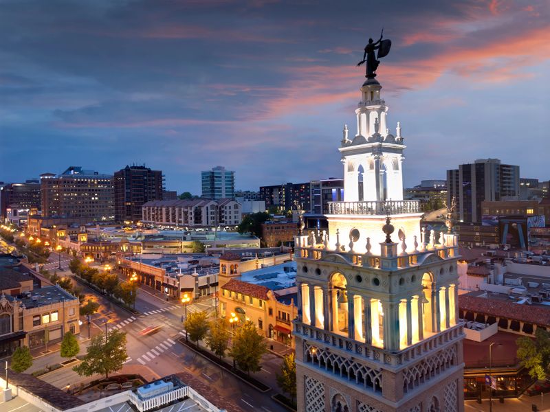 Kansas City, Missouri, USA cityscape and tower at dusk.
