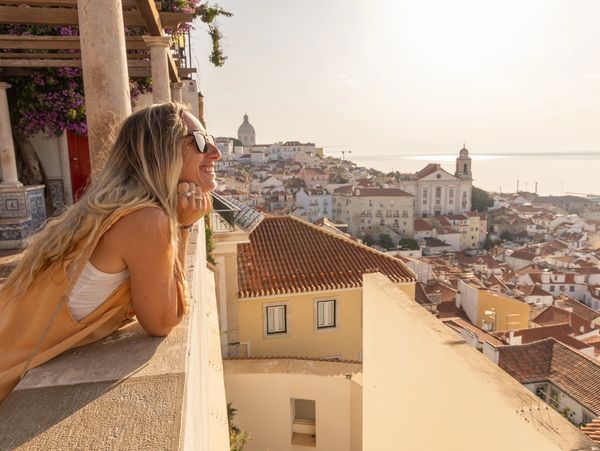 Woman overlooking a small town in Italy