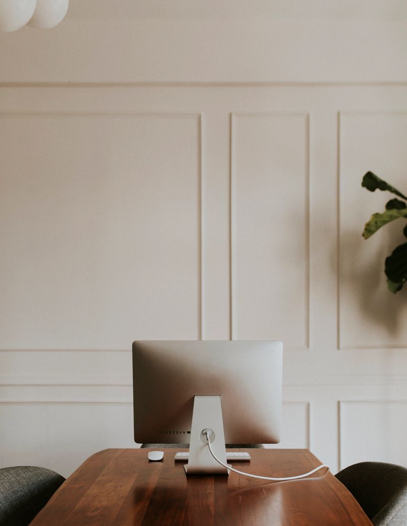 Computer on a wooden table in the office