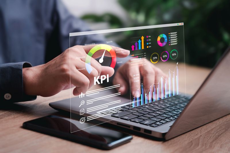 KPI, Key Performance Indicator business analysis concept, Businessman use laptop to show KPI dashboard on virtual screen, Analyze business data report, Finances, Investment, Human management, Target