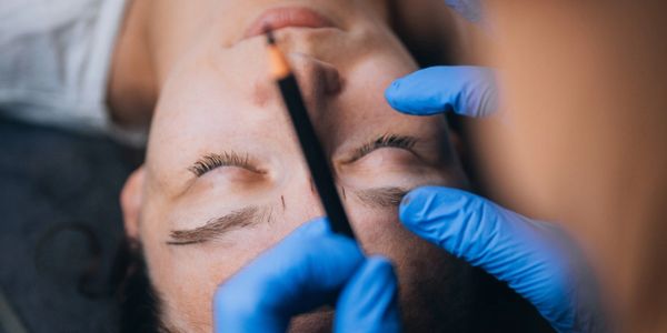 Client receiving perfect microblading.
