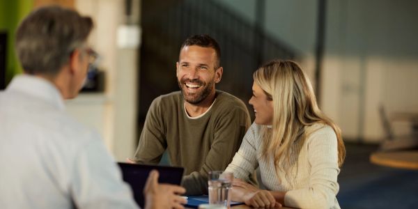 People engaging in a friendly discussion in an office.
